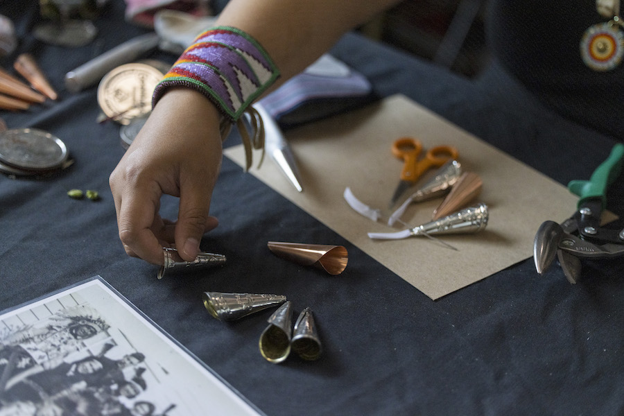 Jennie Kappenman 2020 NAAIR Artist Rolling Jingle dresses at Annishiabbe art festival.